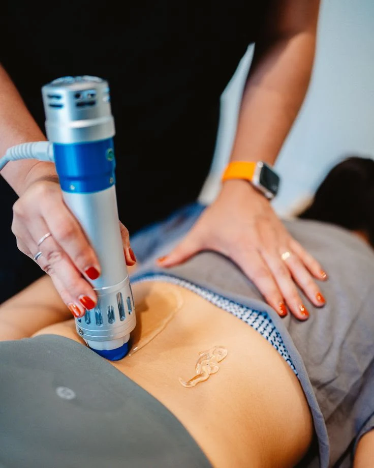 Shockwave therapy treatment device being used on a patient